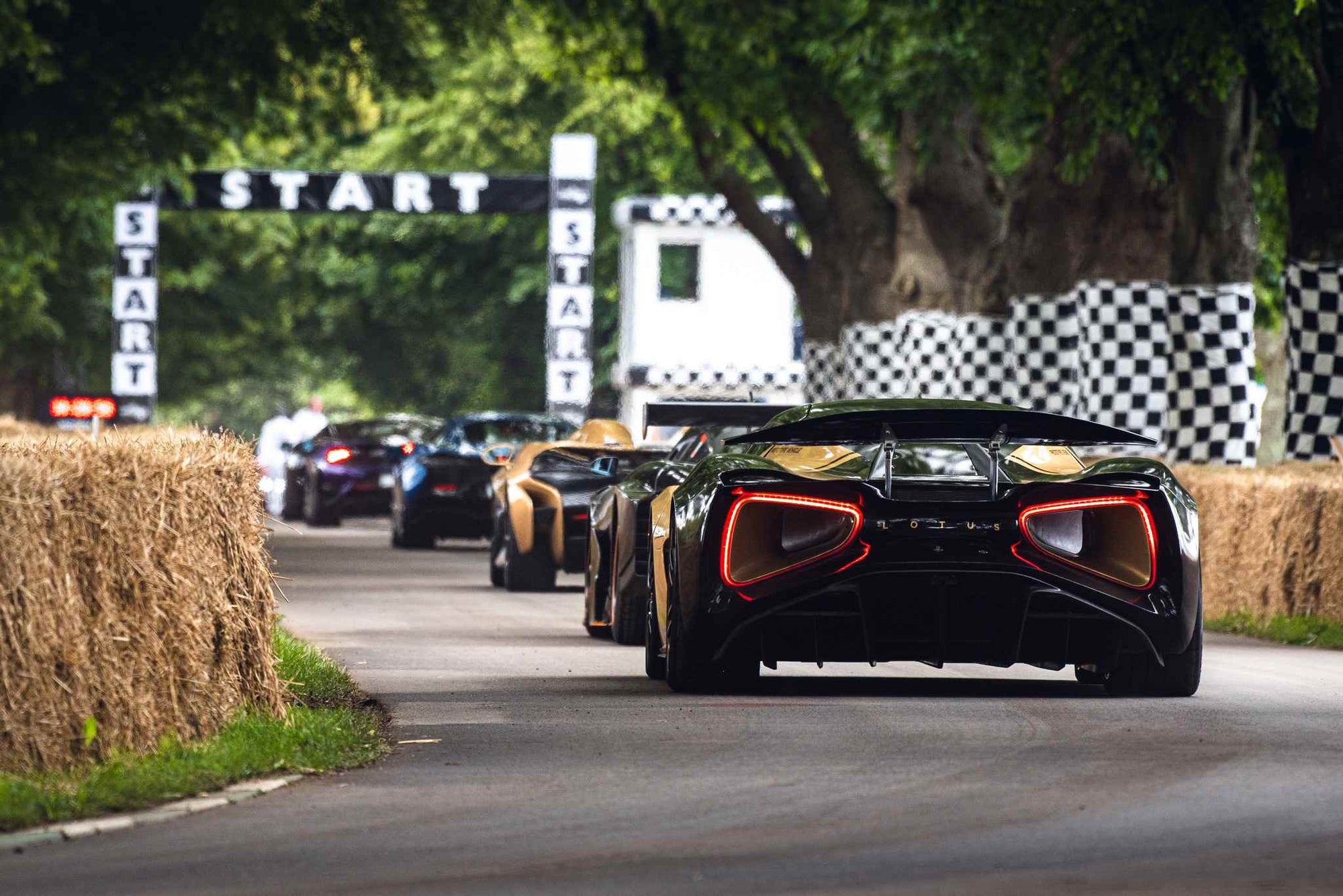 Supercars at the Goodwood hillclimb start line